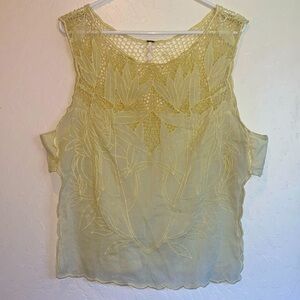 Free People light yellow top with open sides size Lg